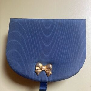 Mikimoto 4.5” x 3.5” x 1.5” jewelry box with bow and Akoya pearl.